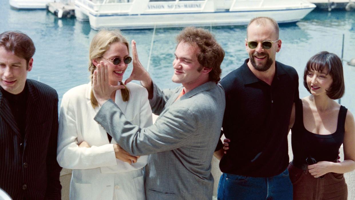  Director Quentin Tarantino (centre) and the cast of Pulp Fiction at Cannes in 1994: (from left to right) John Travolta, Uma Thurman, Tarantino, Bruce Willis and Maria de Medeiros. 
