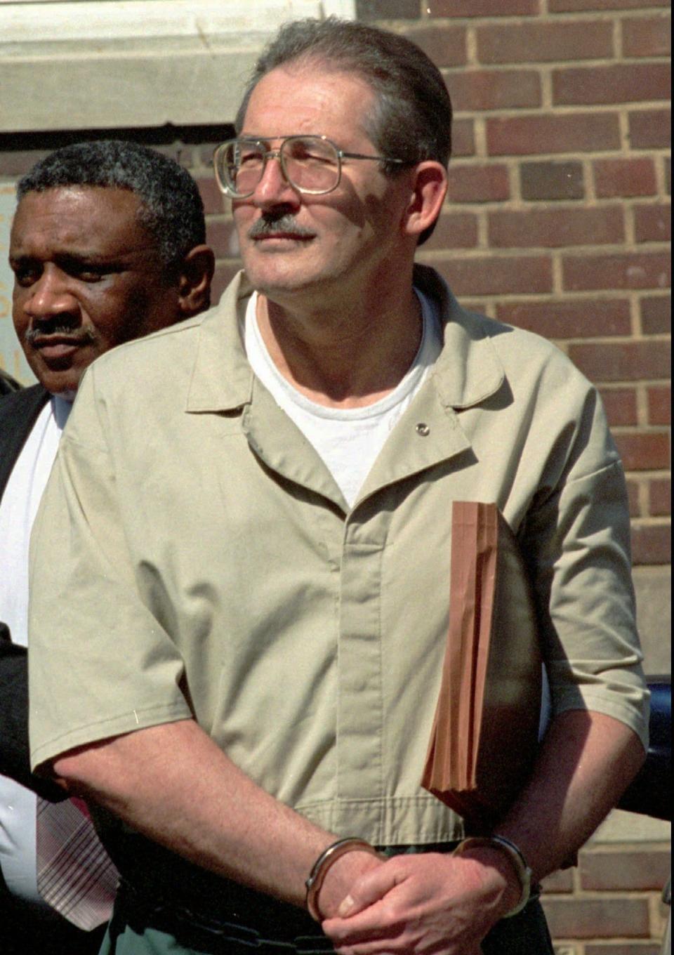 Former CIA agent Aldrich Ames leaves federal court in Alexandria, Va., on April 28, 1994 after pleading guilty to espionage and tax evasion conspiracy charges. Ames, the highest ranking CIA employee ever caught spying, was sentenced to life in prison.