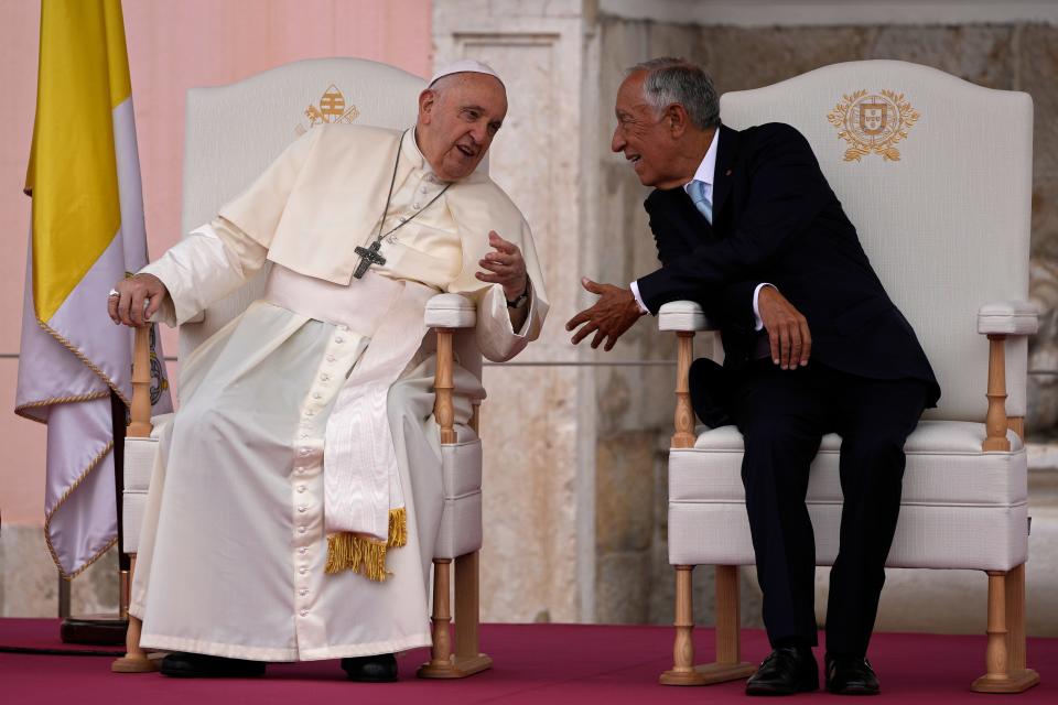 Pope Francis and Portugal's President Marcelo Rebelo de Sousa, right, converse at the Welcome Ceremony at the Belém presidential palace in Lisbon, Wednesday, Aug. 2, 2023. Pope Francis' visit to Portugal includes his participation at the 37th World Youth Day, and a pilgrimage to the holy shrine of Fátima.