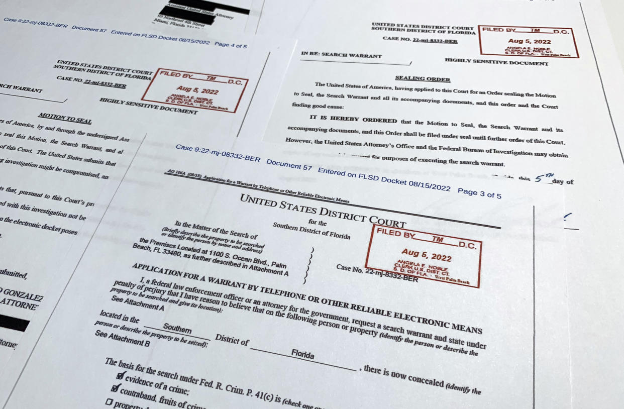 Documents related to the search warrant for former President Donald Trump's Mar-a-Lago estate in Palm Beach, Fla., are photographed Thursday, Aug. 18, 2022. (Jon Elswick/AP)