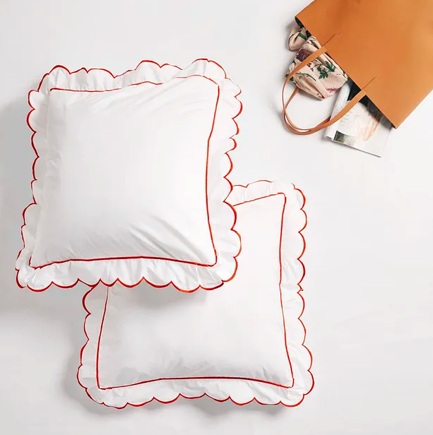 These cotton, <a href="https://fave.co/2OAT2Se" rel="noopener" target="_blank" data-ylk="slk:scalloped border shams by The Label Life;elm:context_link;itc:0;sec:content-canvas" class="link "><strong>scalloped border shams by The Label Life</strong></a>. Size: 23 inches X 23 inches (excluding border). <em>Rs.894 for a pair, on offer.</em> <a href="https://fave.co/2OAT2Se" rel="noopener" target="_blank" data-ylk="slk:Buy here!;elm:context_link;itc:0;sec:content-canvas" class="link "><strong>Buy here!</strong></a>