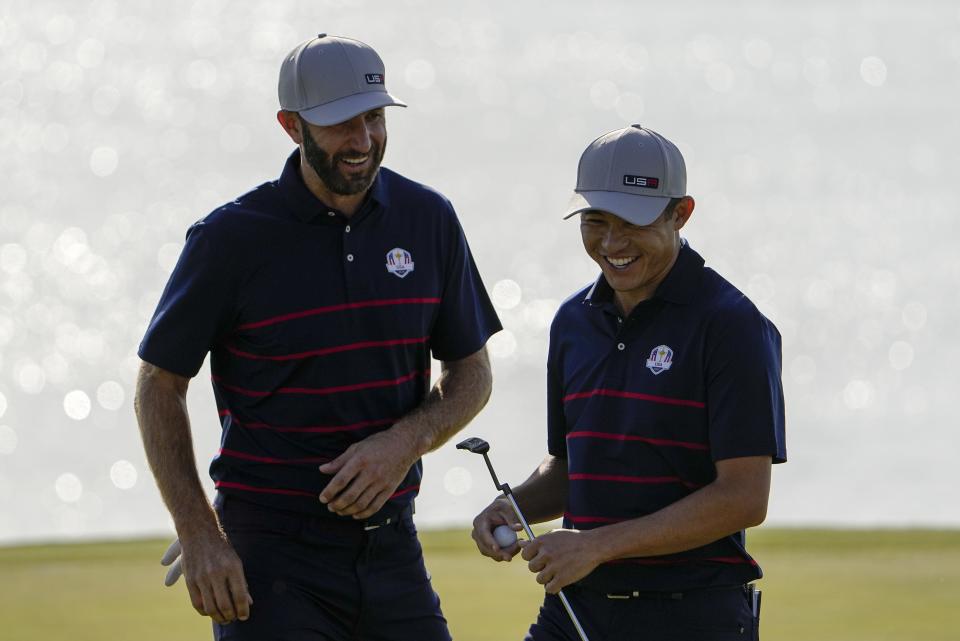 Team USA's Dustin Johnson and Team USA's Collin Morikawa react on the eighth hole during a foursome match the Ryder Cup at the Whistling Straits Golf Course Friday, Sept. 24, 2021, in Sheboygan, Wis. (AP Photo/Jeff Roberson)