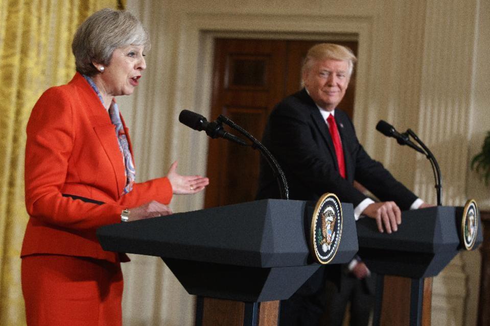 President Donald Trump listens as British Prime Minister Theresa May speaks during a news conference in the East Room of the White House in Washington, Friday, Jan. 27, 2017. (AP Photo/Evan Vucci)