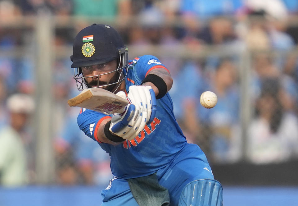 India's Virat Kohli plays a shot during the ICC Men's Cricket World Cup first semifinal match between India and New Zealand in Mumbai, India, Wednesday, Nov. 15, 2023. (AP Photo/Rafiq Maqbool)