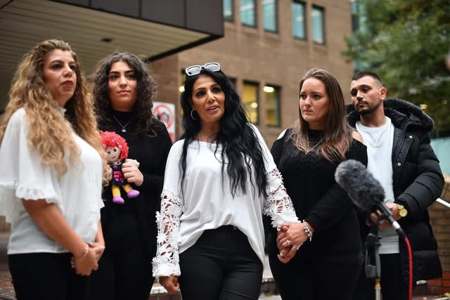 Mihrican 'Jan' Mustafa's cousin Ayse Hussein, left, and sister Mel Mustafa, centre, outside Southwark Crown Court 