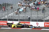 Pole sitter Colton Hereta (26) rounds turn one during the morning practice before the start of the Grand Prix of St. Petersburg auto race, Sunday, April 25, 2021 in St. Petersburg, Fla. (Luis Santana/Tampa Bay Times via AP)