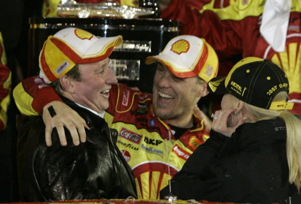 FILE - NASCAR Daytona 500 winner Kevin Harvick, center, celebrates with car owner Richard Childress, left, in victory lane at Daytona International Speedway in Daytona Beach, Fla., Sunday, Feb. 18, 2007. The person at right is not identified. Kevin Harvick said Thursday, Jan. 12, 2023, he will retire from NASCAR competition at the end of the 2023 season. (AP Photo/John Raoux, File)