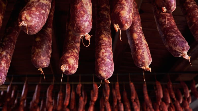 sausages hanging to dry in room