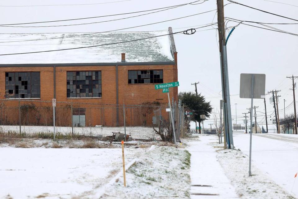 A thin layer of snow coats building and roads near downtown Fort Worth on Monday, January 15, 2024.