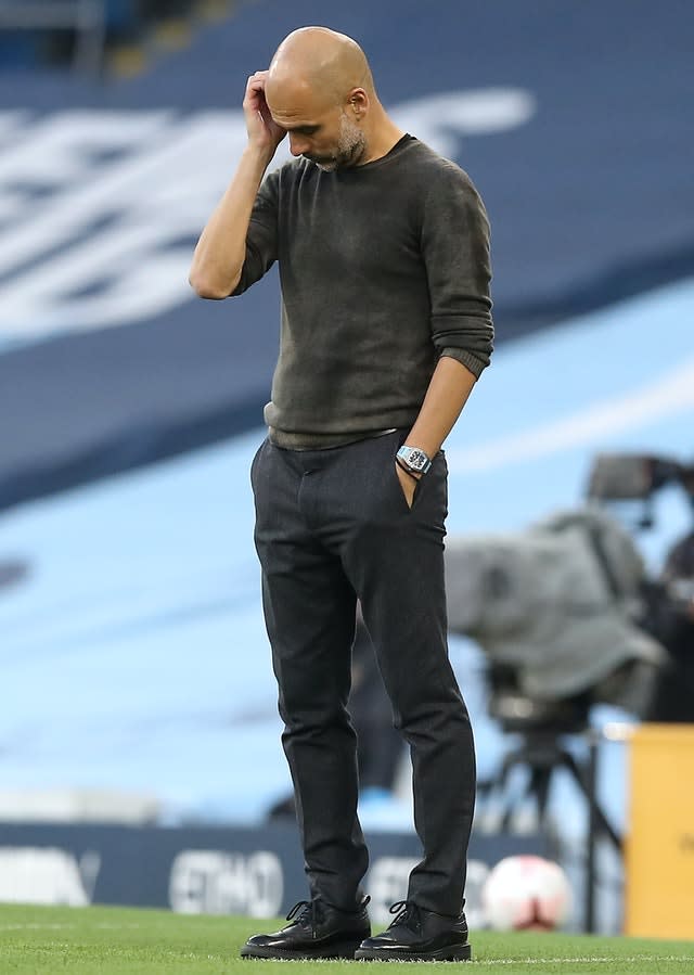 Manchester City manager Pep Guardiola looks on in disbelief during his side's 5-2 home defeat by Leicester