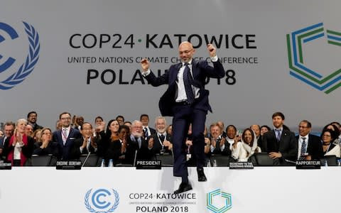 Michal Kurtyka, who led climate talks in Katowice, Poland, shows his relief as an agreement is reached after marathon negotiations - Credit: Kacper Pempel/Reuters