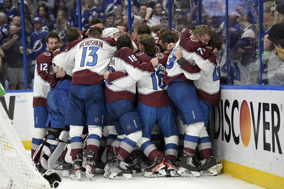 The Colorado Avalanche celebrate winning the Stanley Cup against the Tampa Bay Lightning in Game 6 of the NHL hockey Stanley Cup Finals on Sunday, June 26, 2022, in Tampa, Fla. (AP Photo/Phelan Ebenhack)