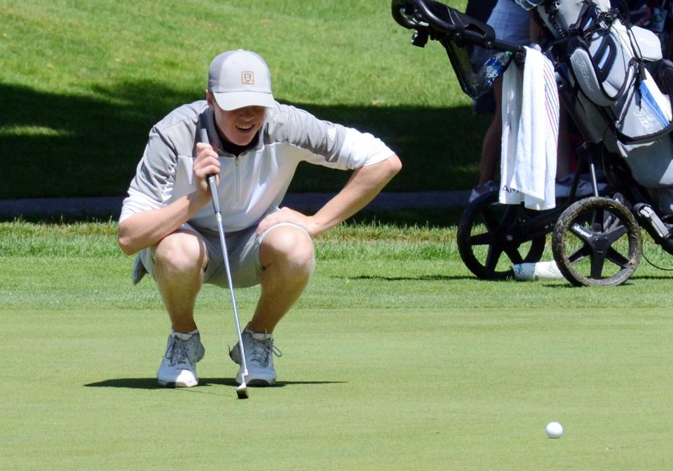 Brady Catalano of Upper Arlington, Ohio sizes up a put on his final hole of The Moor course on Tuesday.