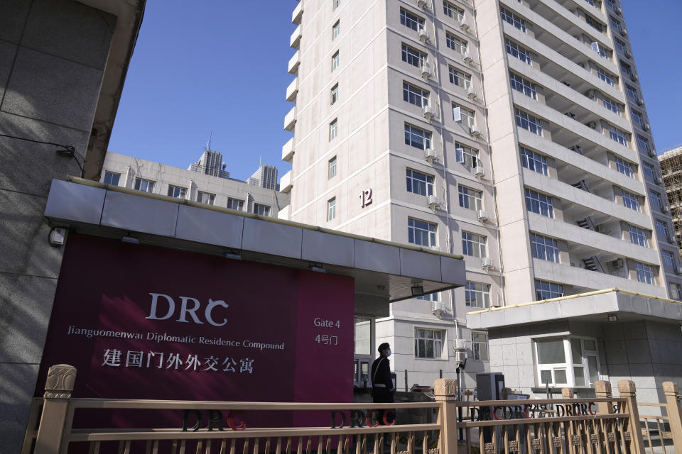 A security guards monitors the entrance to the Jianguomen Diplomatic compound, the last known address for the Canada broadcaster CBC bureau in Beijing, Thursday, Nov. 3, 2022. (AP Photo/Andy Wong)