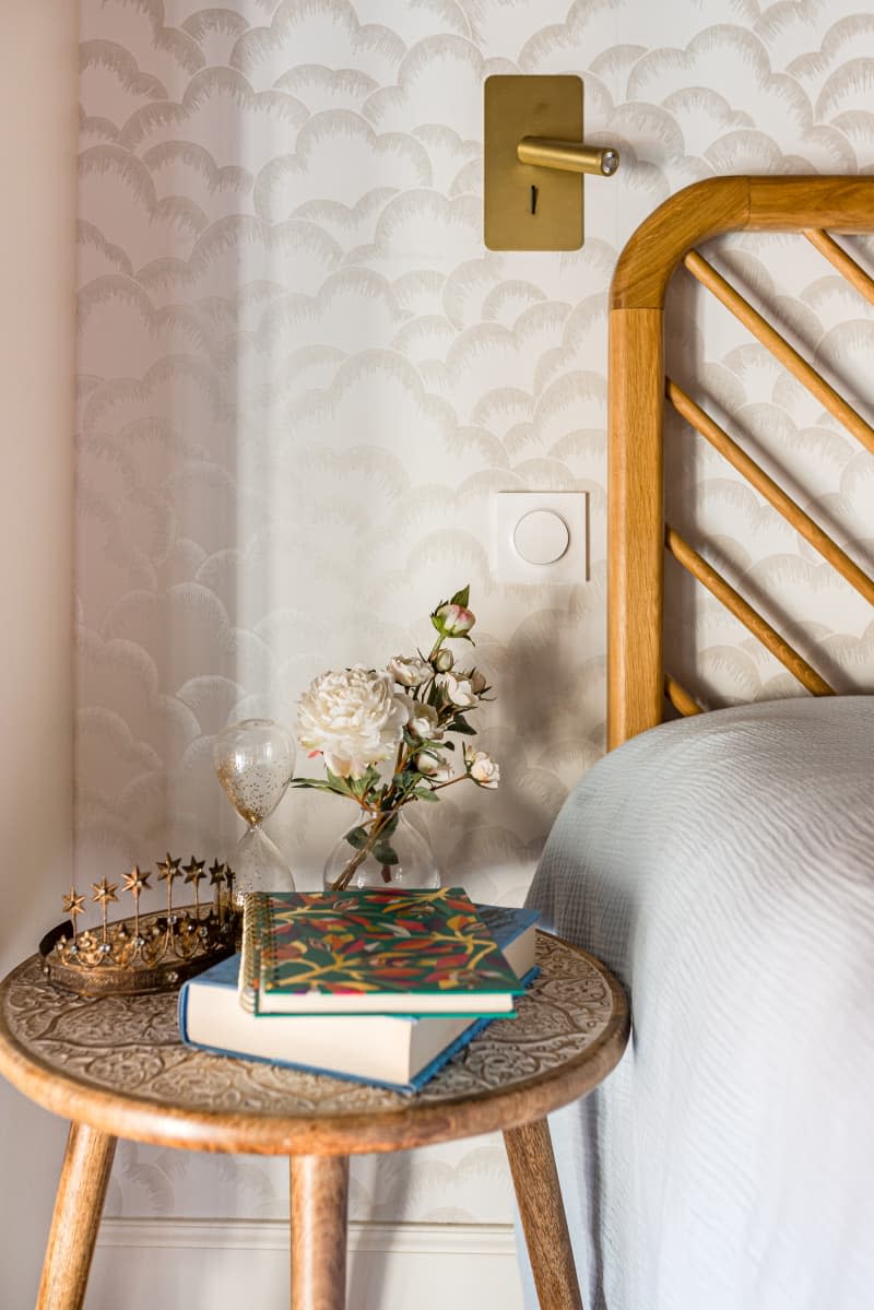 A decorated side table in a bedroom.