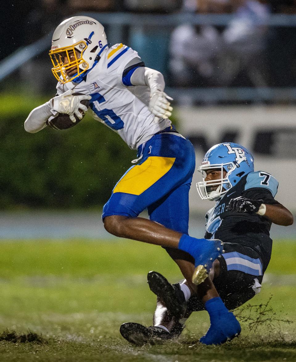  Auburndale (6) Carmelo Henderson escapes a tackle by Lake Region (7) Christopher German after making a catch during first half action in Eagle Lake Fl. Friday September 29 ,2023.Ernst Peters/The Ledger