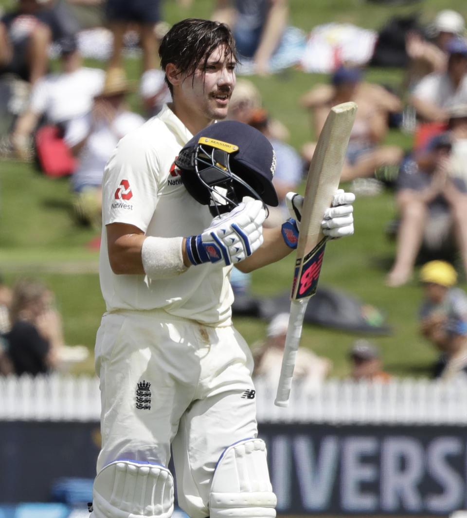 England's Rory Burns celebrates after he scored a century during play on day three of the second cricket test between England and New Zealand at Seddon Park in Hamilton, New Zealand, Sunday, Dec. 1, 2019. (AP Photo/Mark Baker)