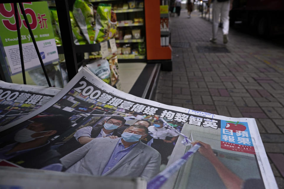 Copies of Apple Daily newspaper with front pages featuring Hong Kong media tycoon Jimmy Lai, are displayed for sale at a newsstand in Hong Kong, Tuesday, Aug. 11, 2020. Hong Kong police arrested Lai and raided the publisher's headquarters Monday, broadening their enforcement of a new security law and raising fears about press freedom in the semi-autonomous Chinese city. (AP Photo/Vincent Yu)