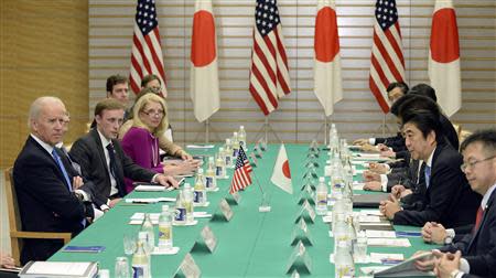 Japanese Prime Minister Shinzo Abe (2nd R) speaks during a meeting with U.S. Vice President Joe Biden at Abe's official residence in Tokyo December 3, 2013. REUTERS/Toru Yamanaka/Pool