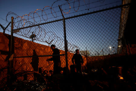 Central American migrants are seen inside an enclosure where they are being held by U.S. Customs and Border Protection (CBP), after crossing the border between Mexico and the United States illegally and turning themselves in to request asylum, in El Paso, Texas, March 28, 2019. REUTERS/Jose Luis Gonzalez