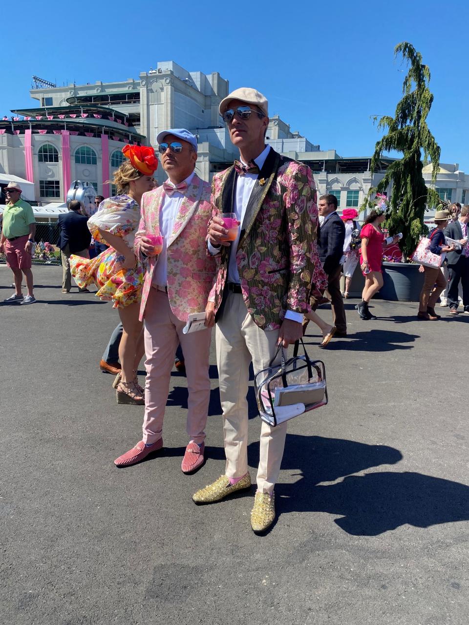 Two men at the Kentucky Oaks with floral jackets and flashy footwear. May 5, 2023