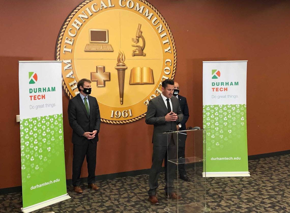Durham-based KBI BioPharma CEO Dirk Lange announces with Durham Tech president J.B. Buxton and N.C. Community Colleges president Thomas Stith III a new initiative that will offer high school graduates and veterans the opportunity to get job training in the life science and biotech industries.