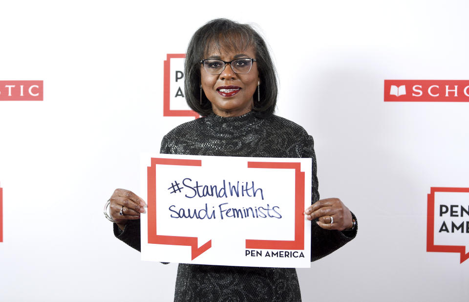 PEN courage award recipient Anita Hill poses holding a sign in support of jailed Saudi women's rights activists Nouf Abdulaziz, Loujain Al-Hathloul and Eman Al-Nafjan at the 2019 PEN America Literary Gala at the American Museum of Natural History on Tuesday, May 21, 2019, in New York. (Photo by Evan Agostini/Invision/AP)