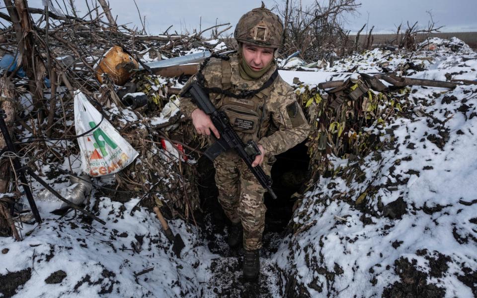 A Ukrainian soldier takes his position on the frontline near Klishchiivka the Donetsk region, Ukraine