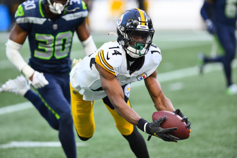 Pittsburgh Steelers wide receiver George Pickens (14) catches a pass against the Seattle Seahawks during the second half at Lumen Field.