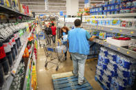 People shop for bottled water after a boil water notice was issued for the entire city of Houston on Sunday, Nov. 27, 2022, at Walmart on S. Post Oak Rd. in Houston. (Mark Mulligan/Houston Chronicle via AP)