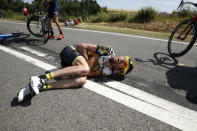 Lotto-Jumbo rider Laurens ten Dam of the Netherlands lies on the ground after a fall during the 159,5 km (99 miles) third stage of the 102nd Tour de France cycling race from Anvers to Huy, Belgium, July 6, 2015. REUTERS/Benoit Tessier