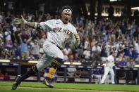 Milwaukee Brewers' Kolten Wong reacts after hitting a two-run scoring single during the eighth inning of a baseball game against the Chicago Cubs Friday, Sept. 17, 2021, in Milwaukee. (AP Photo/Morry Gash)