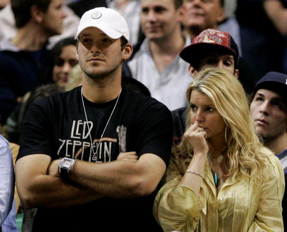 Tony Romo and Jessica Simpson were connected for a long time, a connective symbol of failure. (AP)