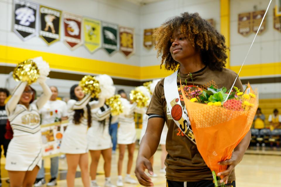 Jameelah Pharms drinks in the applause from her supporters during senior night festivities at Stagg High School before their game against Cesar Chavez high in Stockton,CA