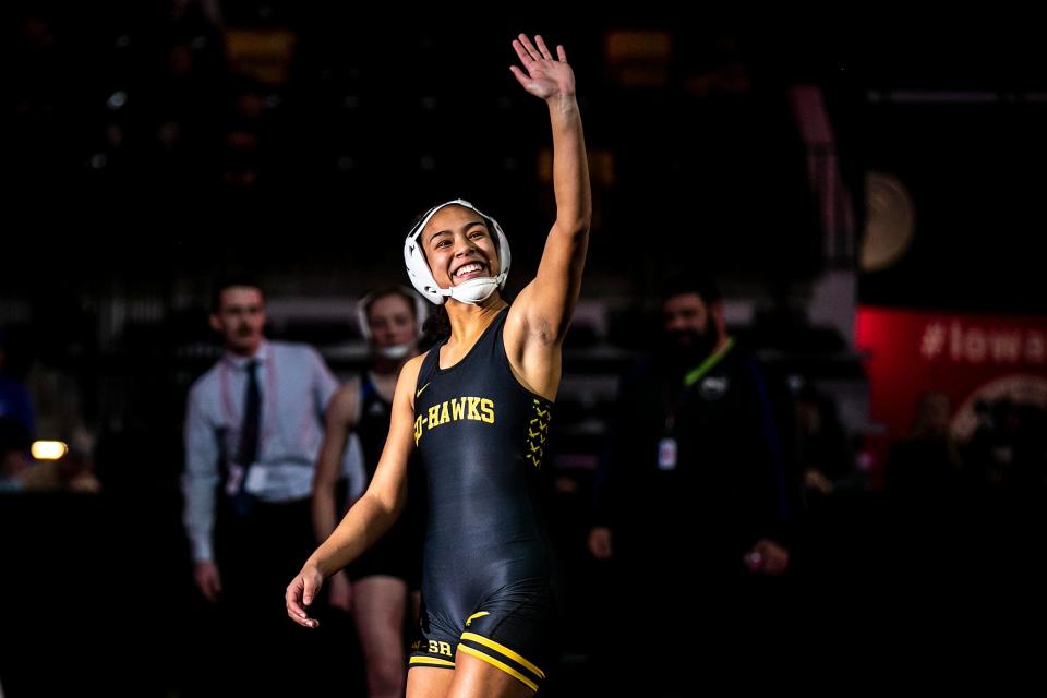 Waverly-Shell Rock's Kiara Djoumessi waves to her supporters before wrestling at 140 pounds in the finals during the IGHSAU state girls wrestling tournament, Friday, Feb. 3, 2023, at the Xtream Arena in Coralville, Iowa.