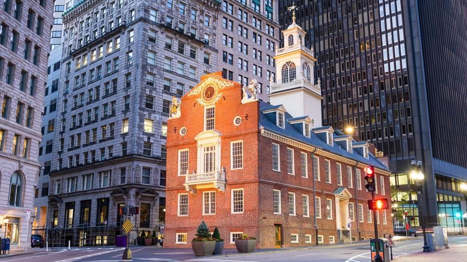 Boston, Massachusetts, at the USA Old State House and cityscape at dawn.