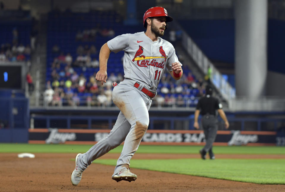 St. Louis Cardinals' Paul DeJong rounds third base on the way to scoring during the second inning of the team's baseball game against the Miami Marlins, Tuesday, April 19, 2022, in Miami. (AP Photo/Jim Rassol)