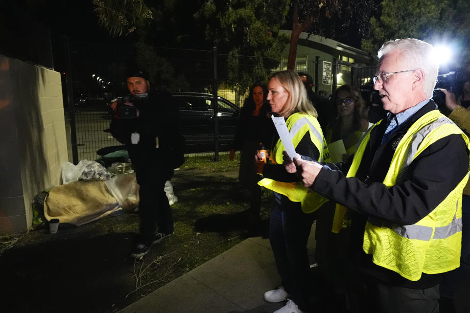 Los Angeles City Council President Paul Krekorian, right, joined by Supervisor Kathryn Barger, center, who represents the 5th supervisorial district of Los Angeles County, walks on the streets at the start of the annual homeless count in the North Hollywood section of Los Angeles Tuesday, Jan. 23, 2024. (AP Photo/Richard Vogel)
