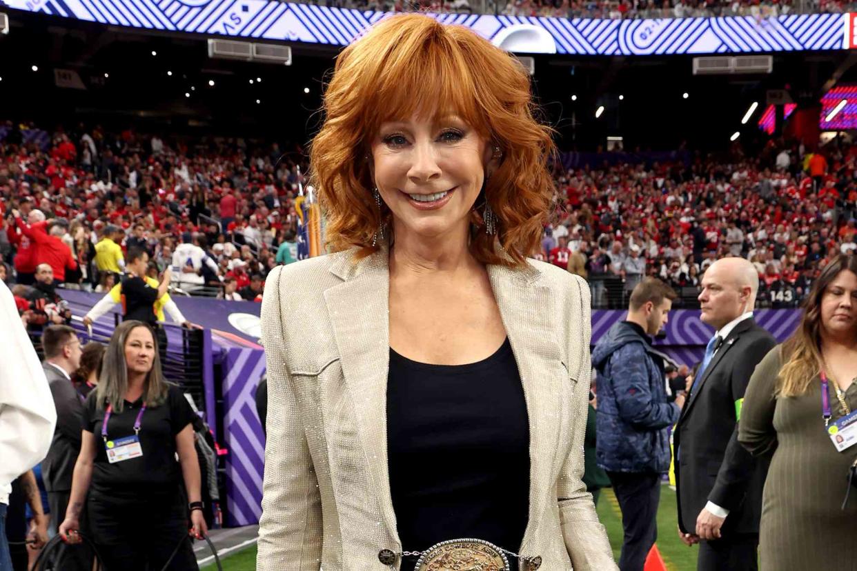 <p>Kevin Mazur/Getty </p> Reba McEntire at the Super Bowl