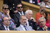Spain's King Felipe, center, sits in the Royal Box on Centre Court for the final of the men's singles between Spain's Carlos Alcaraz and Serbia's Novak Djokovic on day fourteen of the Wimbledon tennis championships in London, Sunday, July 16, 2023. (AP Photo/Kirsty Wigglesworth)
