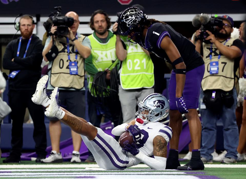Kansas State cornerback Julius Brents (23) intercepts a TCU pass in front of Horned Frogs wide receiver Quentin Johnston (1) during the 2022 Big 12 championship game at AT&T Stadium. Brents, a former Iowa transfer, was selected in the second round of the 2023 NFL Draft.