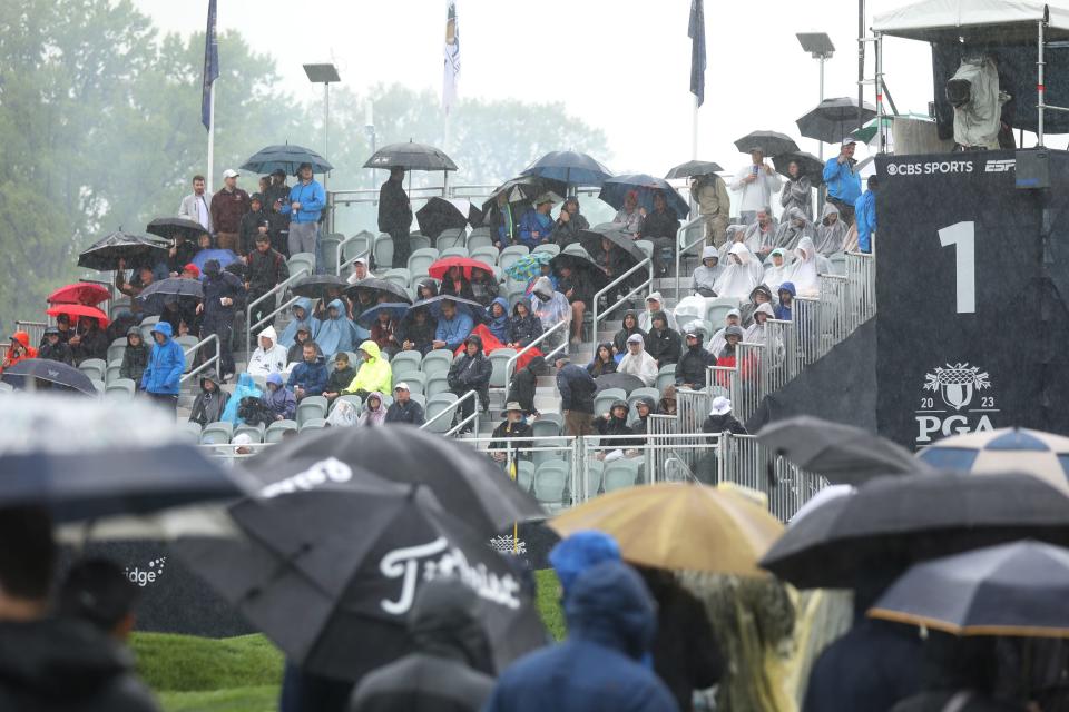 The crowd was prepared for the rain Saturday with many people using umbrellas to keep themselves dry.