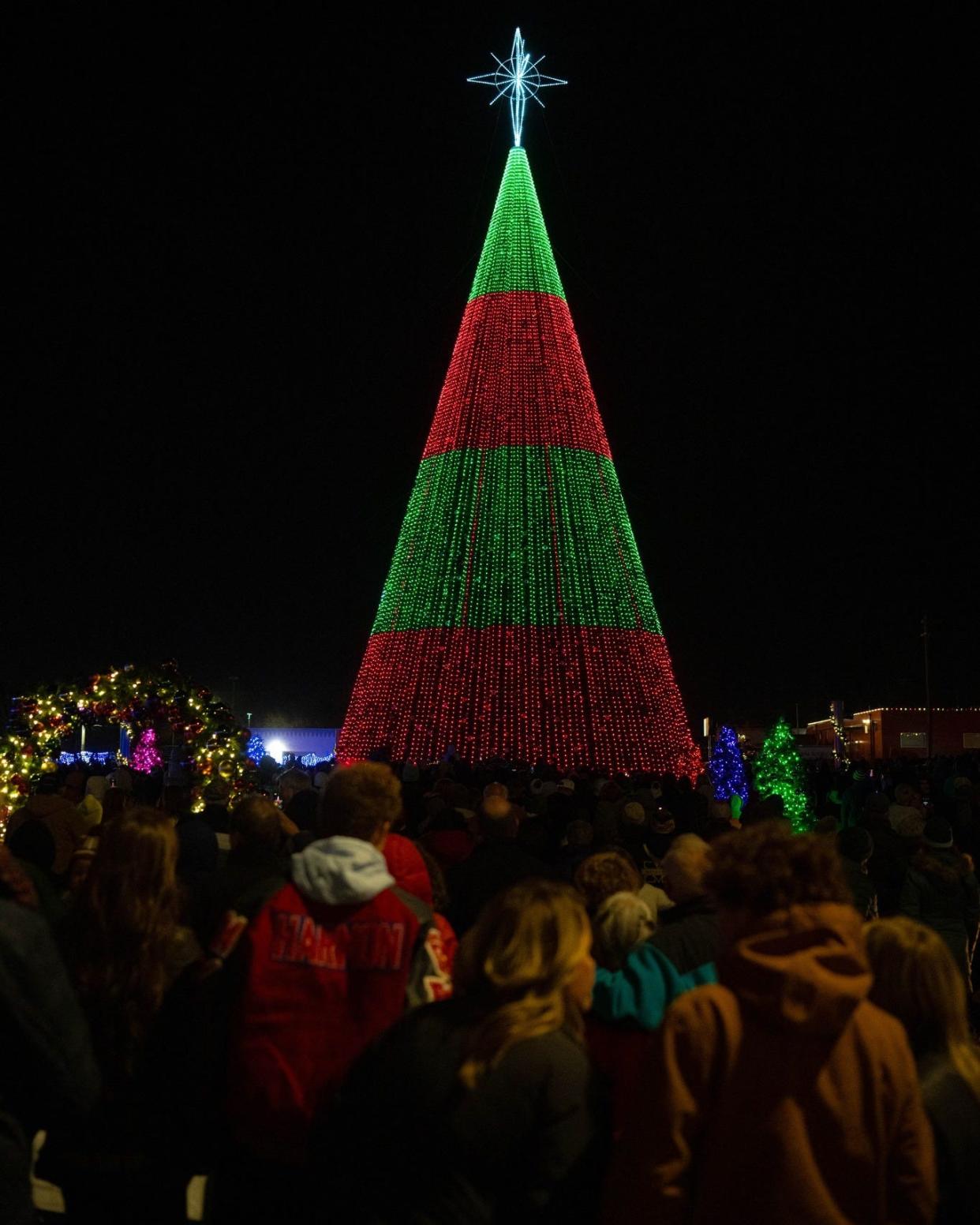 People attend the Dec. 3 opening-night festivities in Enid for The One: Bright Lights, a free multi-event holiday experience featuring what's billed as one of the world's tallest Christmas trees, dubbed the "Christ Tree." This year's Christ Tree is a steel 102-foot-tall conifer adorned with a 20-foot Bethlehem star and 35,000 LED lights choreographed to Christmas songs.