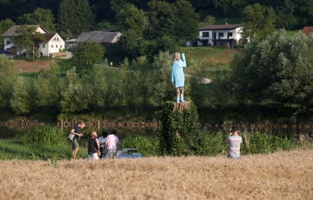 Life-size wooden sculpture of U.S. first lady Melania Trump is officially unveiled in Rozno, near her hometown of Sevnica