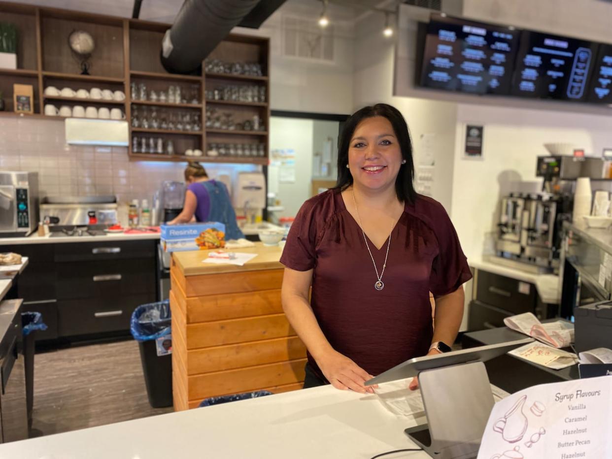 Michelle Brooks is serving up more than just coffee and an event space at her new business in Regina. Her goal is to make both Indigenous and non-Indigenous customers feel welcome.  (Louise BigEagle photo - image credit)