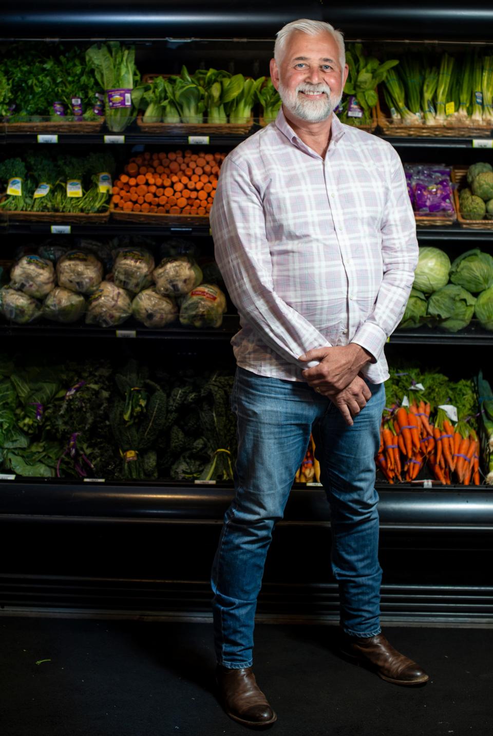John Dyke, owner of Turnip Truck, poses inside the West Nashville Turnip Truck store on Tuesday, May 11, 2021 in Nashville, Tenn. Dyke is proud of the store's produce section that has a broad selection of locally sourced produce. 