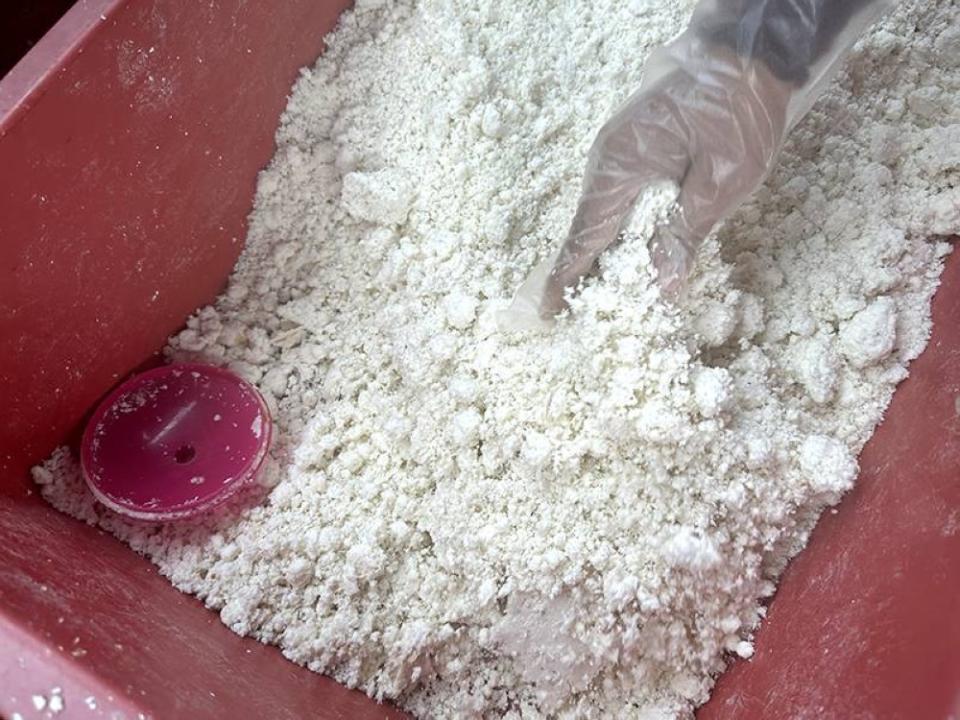 'Putu halba' is prepared using grated cassava where the starch is wrung out using a muslin cloth.