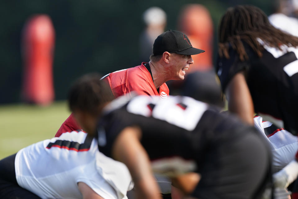 Atlanta Falcons quarterback Matt Ryan (2) runs a drill during their NFL training camp football practice Saturday, July 31, 2021, in Flowery Branch, Ga. (AP Photo/John Bazemore)