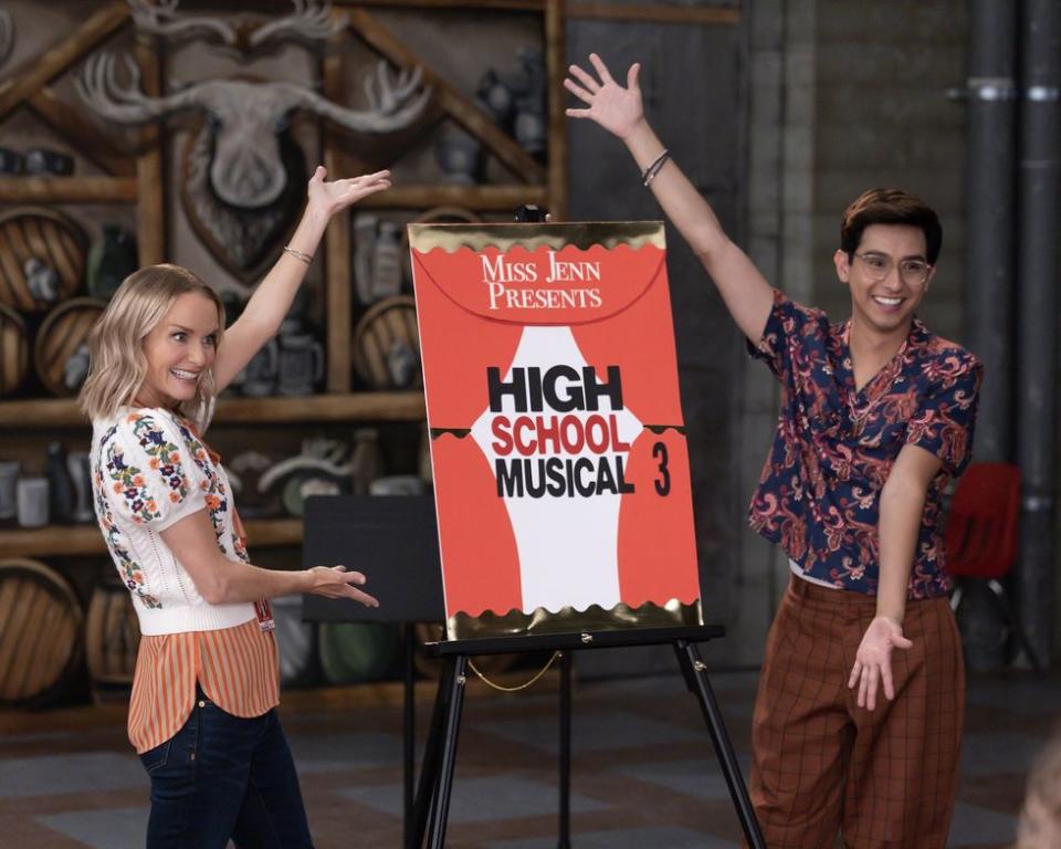 Kate Reinders and Frankie A. Rodriguez with a 'High School Musical 3' sign.