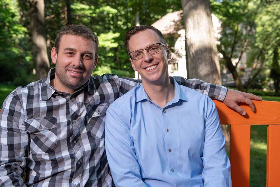 Jon Hoadley with his husband, Kris, left. (Trumpie Photography)